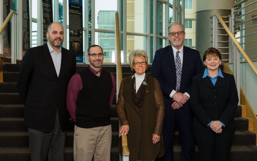 Photograph of 5 members of the Board of Directors.