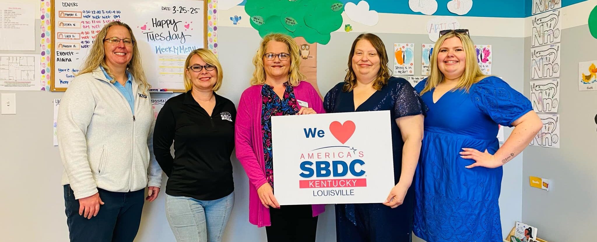 Amanda Kelly with SBDC and Jennifer Caudill, owner of Crestwood, KY daycare Butterfly Garden Academy.