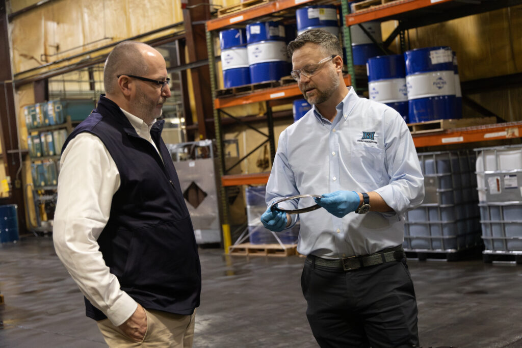 Brett Traver tours the LML facility in Stanford, Ky. with Jordan Dick.